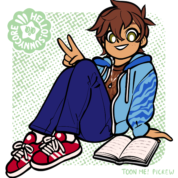 chubby boy sitting next to book holding up peace sign