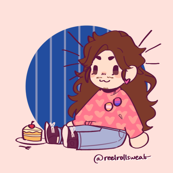 long-haired androgynous person with beard sitting next to cake on ground wearing pangender and bisexual pride pins